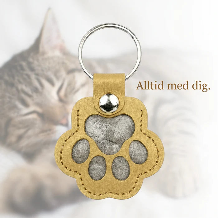 Pote-nøkkelring som lar deg forevige et varmt minne om kjæledyret ditt