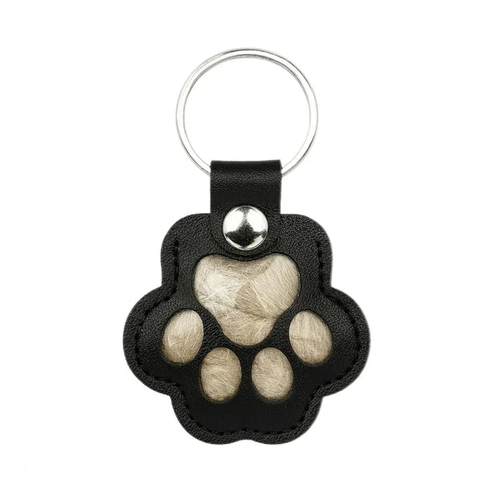 Pote-nøkkelring som lar deg forevige et varmt minne om kjæledyret ditt