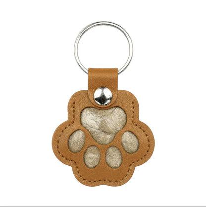 Pote-nøkkelring som lar deg forevige et varmt minne om kjæledyret ditt